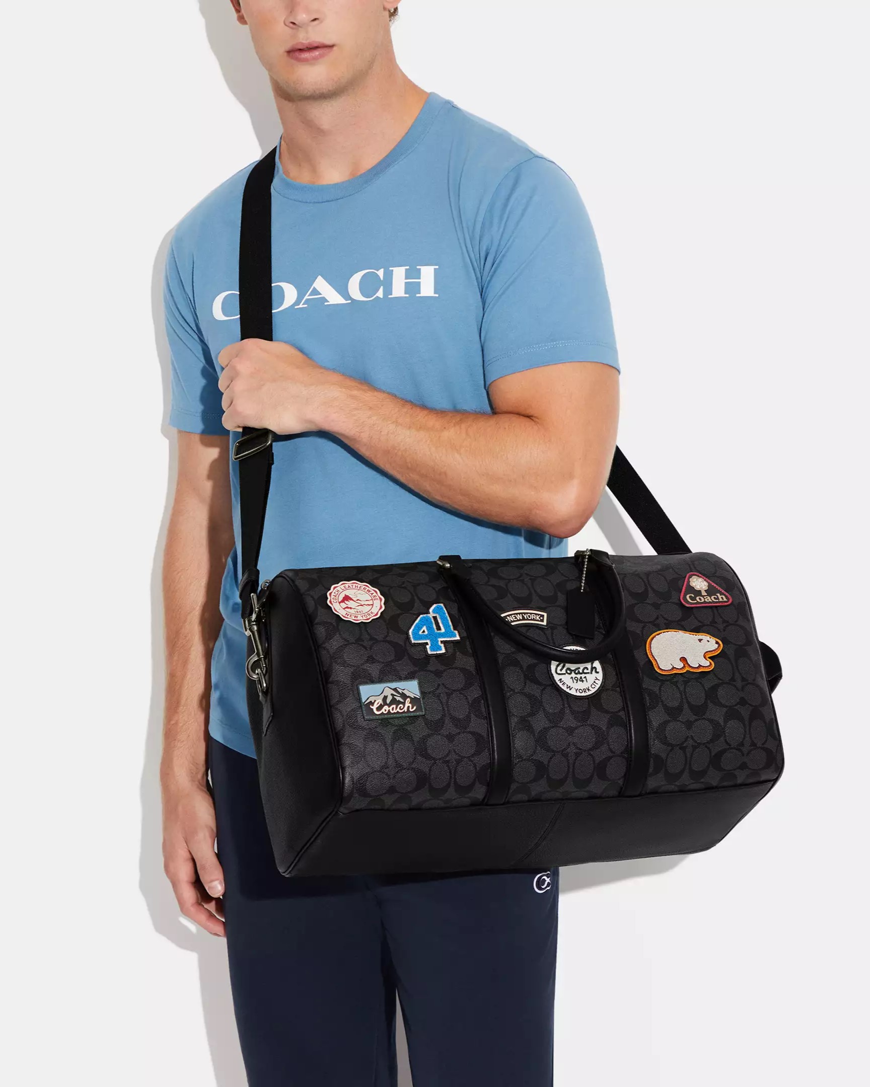 TÚI XÁCH ĐEO CHÉO DU LỊCH COACH VENTURER BAG IN SIGNATURE CANVAS WITH SKI PATCHES CE553 3