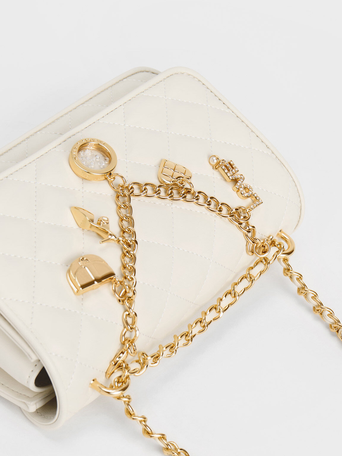 TÚI XÁCH NỮ CHARLES AND KEITH CHARM EMBELLISHED QUILTED CLUTCH 4