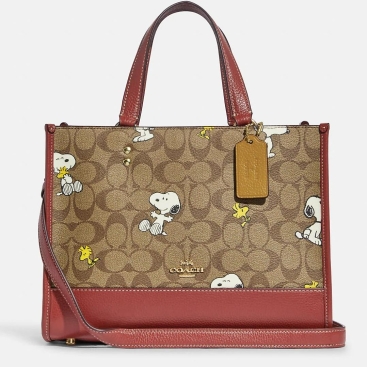 Túi nữ đeo chéo Coach X Peanuts Dempsey Carryall In Signature Canvas With Snoopy Woodstock Print
