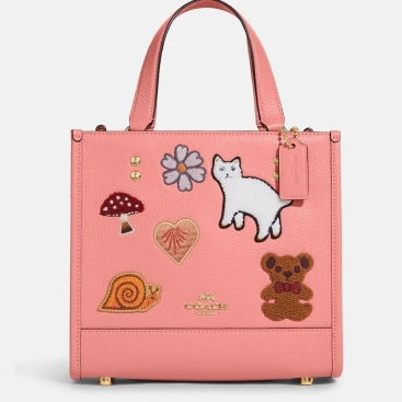 Túi đeo chéo Coach Dempsey Tote 22 With Creature Patches